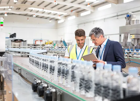 two men in a manufacturing environment