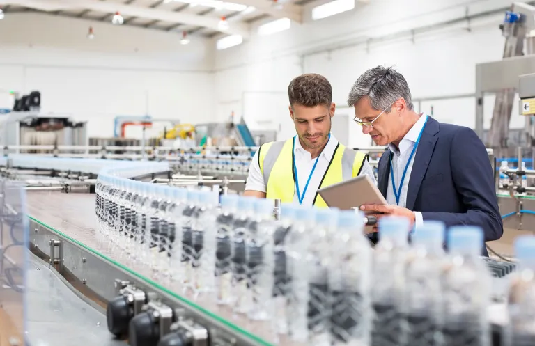 two men on factory floor